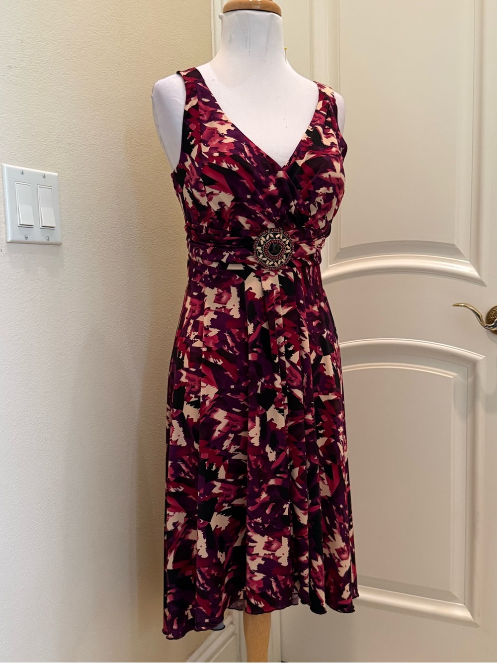 True Envy knit jersey hi-low dress with beaded center medallion